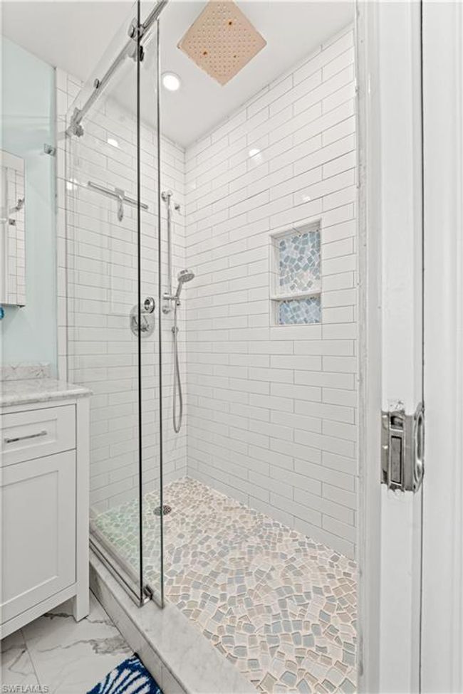 Full bath featuring recessed lighting, a shower stall, marble finish floor, and vanity | Image 13