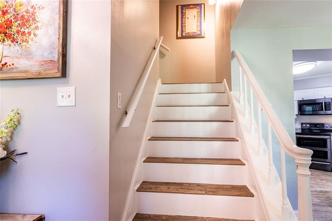 View of stairs as you enter through the french doors. | Image 6