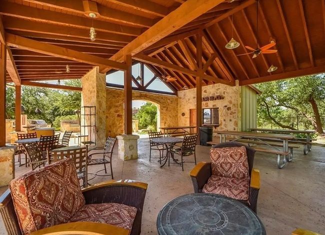 View Beach club outdoor dining space, a gazebo, and ceiling fan | Image 20