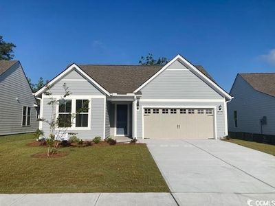 View of front of property with a garage and a front yard | Image 1