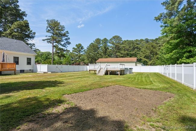 View of yard featuring a deck | Image 32