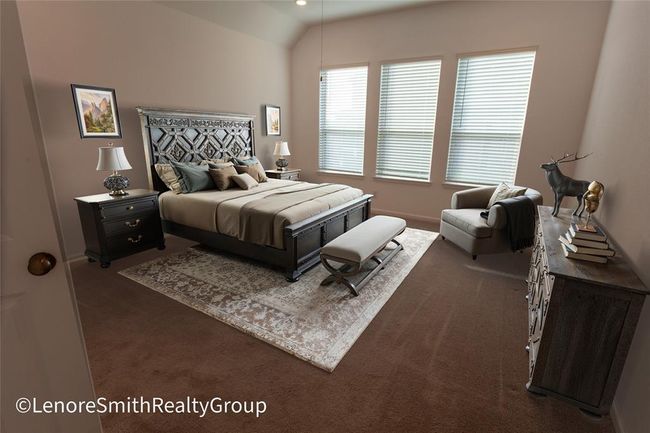 This spacious room features neutral carpeting, high ceilings, and large windows with blinds, allowing plenty of natural light. | Image 4