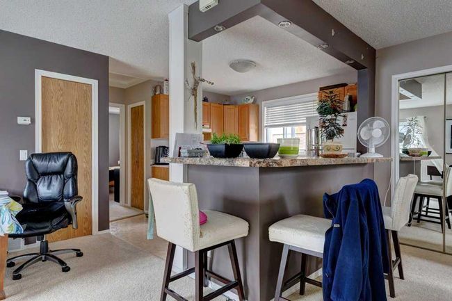 127 Millcrest Way Sw, Home with 4 bedrooms, 2 bathrooms and 2 parking in Calgary AB | Image 6