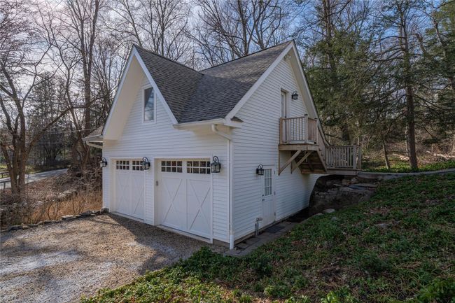Garage featuring dirt driveway | Image 20