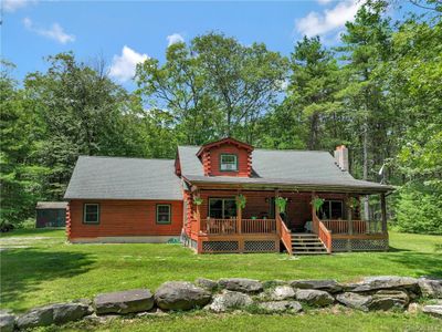 Log cabin with a front yard | Image 1