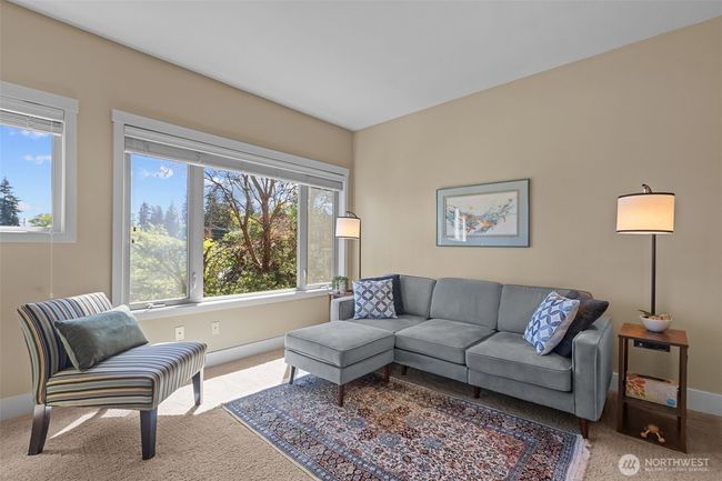 Large east-facing, sun drenched, wood-wrapped windows get ALL the morning sun into the main living space of the home. On a day like today, the lights are hardly effective. I love natural light! | Image 8