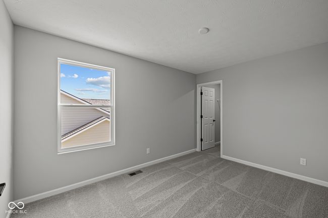 carpeted empty room with baseboards and visible vents | Image 18