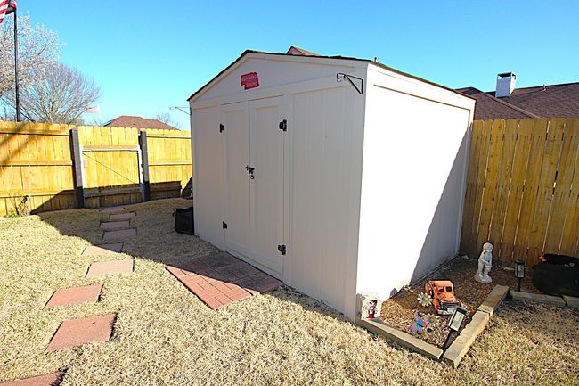 View of 8X8 shed with a fenced backyard | Image 39