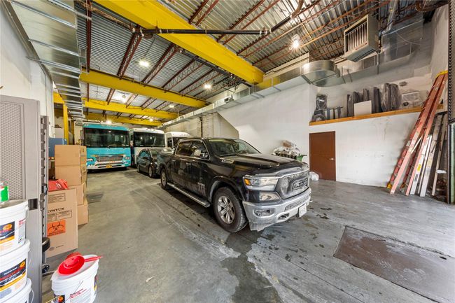 Garage featuring water heater | Image 11