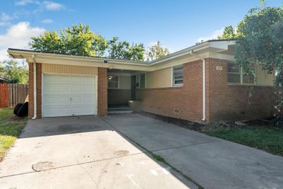 Ranch-style house featuring a garage | Image 3