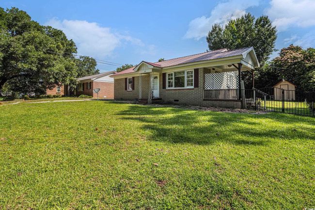 Ranch-style home featuring crawl space and a metal roof | Image 4