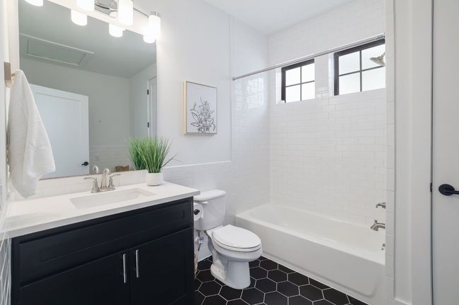 Garage apartment bathroom including washer/dryer hook ups | Image 28