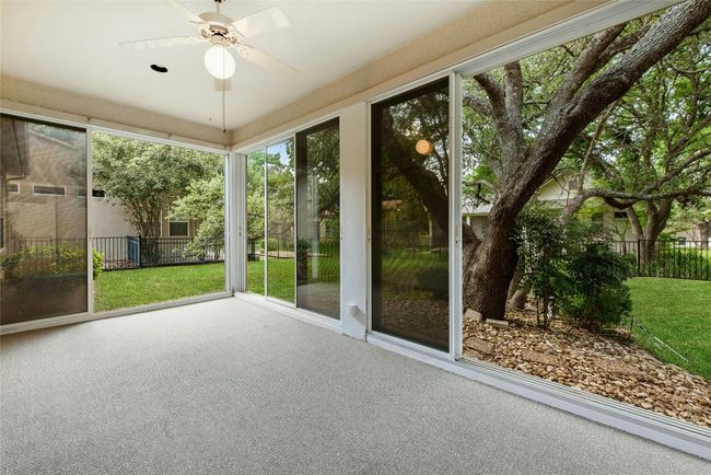 Unfurnished sunroom with a ceiling fan | Image 21