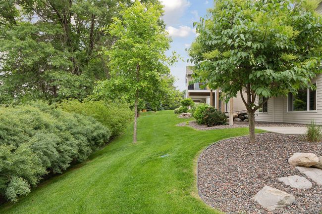 Gorgeous setting with lush lawn and tree lined for privacy | Image 46