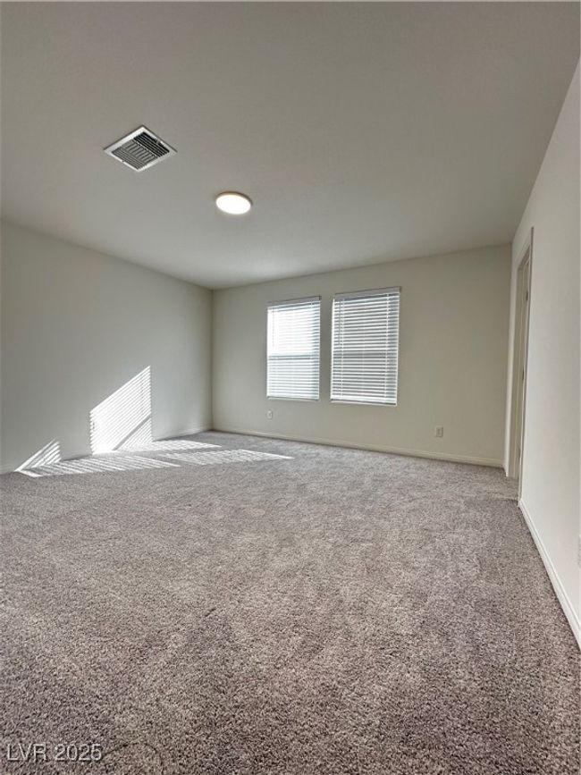 Spare room featuring carpet, visible vents, and baseboards | Image 10