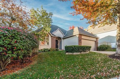 View of front of house featuring a front yard and a garage | Image 2