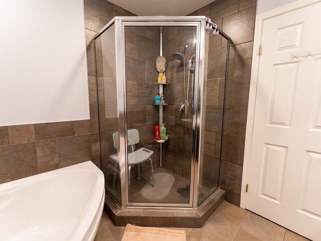 Full bath featuring a garden tub, tile patterned floors, and a shower stall | Image 27