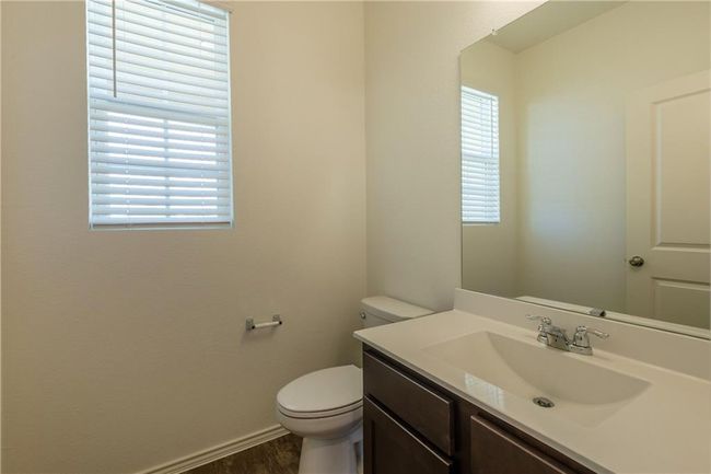 Bathroom featuring healthy amount of natural light, vanity, and wood finished floors | Image 20