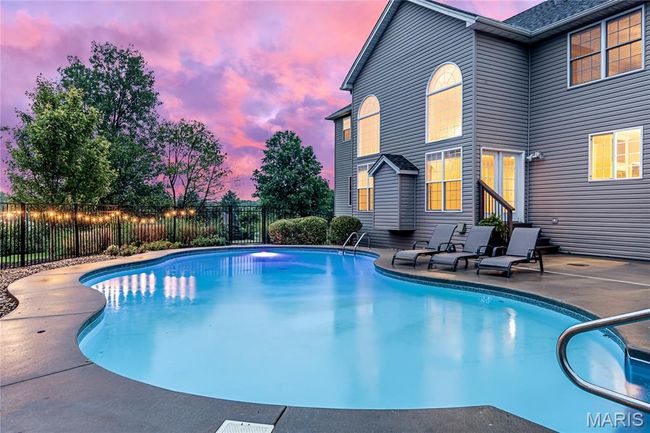 View of pool featuring a patio area | Image 4