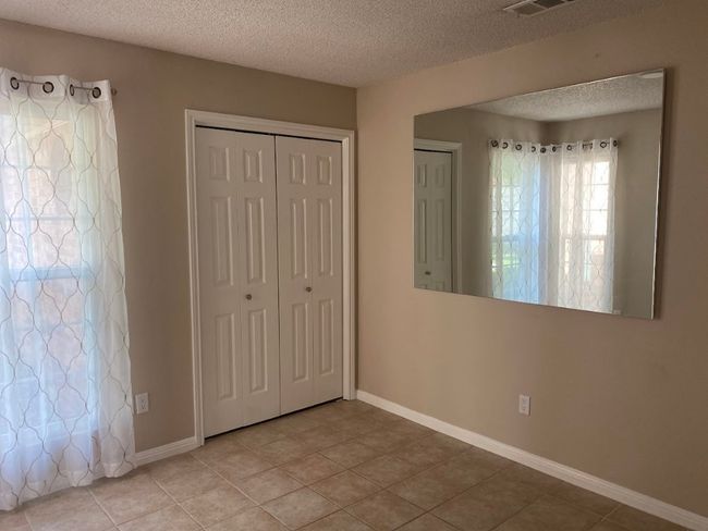 Another view of the 4th bedroom by the entry which makes a great office! | Image 10