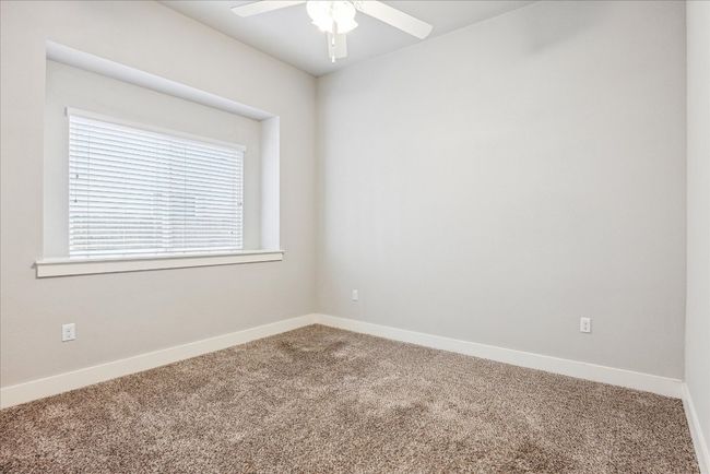 Spare room featuring carpet floors, ceiling fan, and baseboards | Image 22