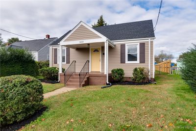 Bungalow featuring a front lawn | Image 1