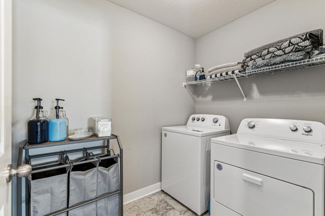 Laundry room located upstairs. | Image 20