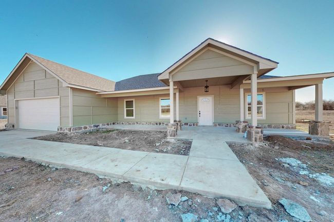 View of front of property with a garage | Image 6