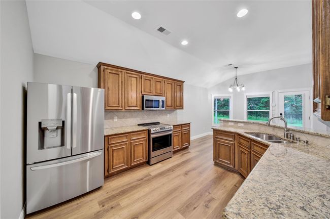 The refrigerator, washer, and dryer will all stay with the home! | Image 13