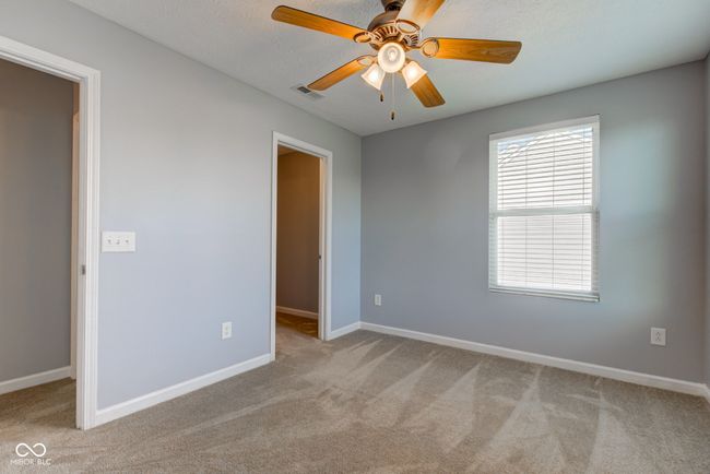 carpeted empty room featuring baseboards and a ceiling fan | Image 43