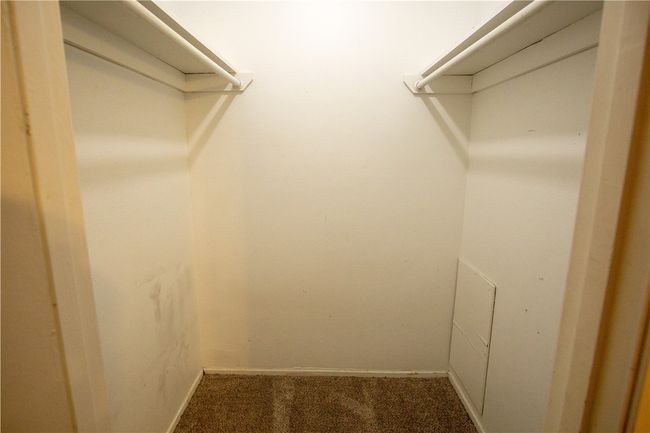 Walk in closet with carpet floors | Image 6