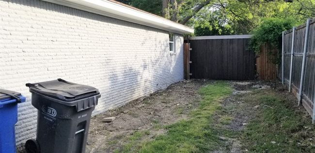 Gate entrance to drive into backyard from side yard. | Image 32