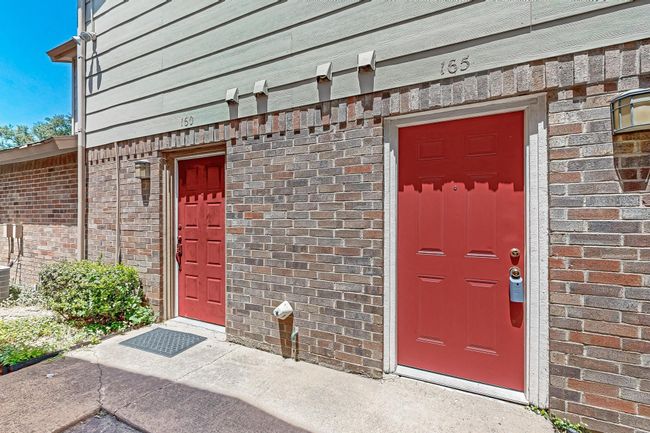 Doorway to property with brick siding | Image 30