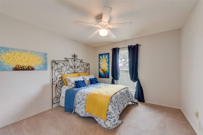 Bedroom with carpet, a ceiling fan, and baseboards | Image 26
