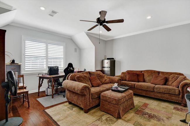 Living area with ceiling fan, hardwood / wood-style flooring, an office area, ornamental molding, and recessed lighting | Image 29