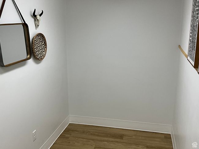 Interior space with dark wood-style flooring and baseboards | Image 22