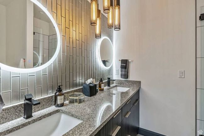 Bathroom with double vanity and a sink | Image 45