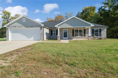 beautiful variegated modern brick with black accent features, plus a huge covered front porch! | Image 1