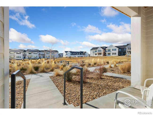 Covered front porch entry looks west over park | Image 27