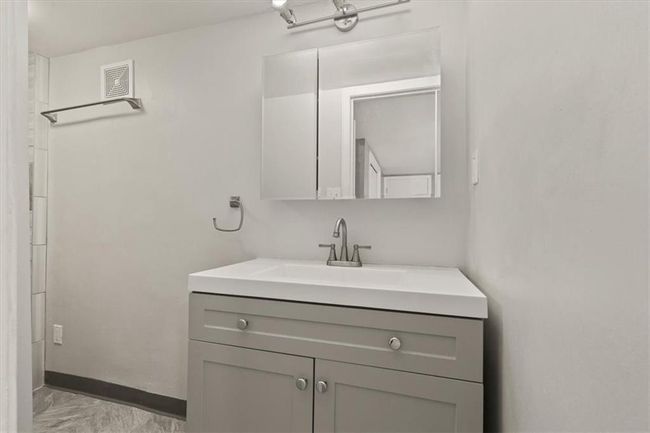 Bathroom with vanity and marble finish flooring | Image 21