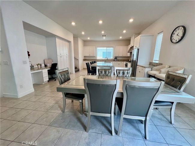 The dining room with a compact home office nook on the left side. | Image 5