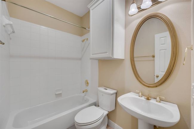 Bathroom with a sink and shower combination | Image 26