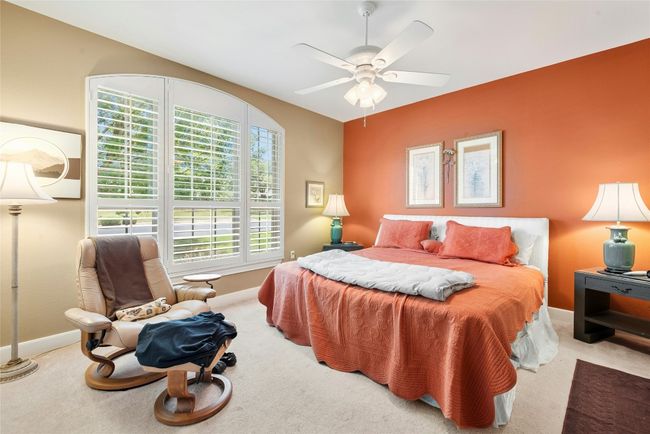 Bedroom with carpet and ceiling fan | Image 19