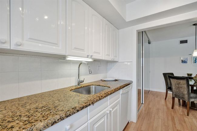 Beautiful granite countertops and plenty of kitchen cabinets | Image 19