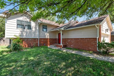 View of front of home featuring a garage and a front yard | Image 3