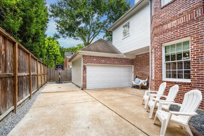 2 car garage with an extra parking space behind the electrified gate! | Image 30