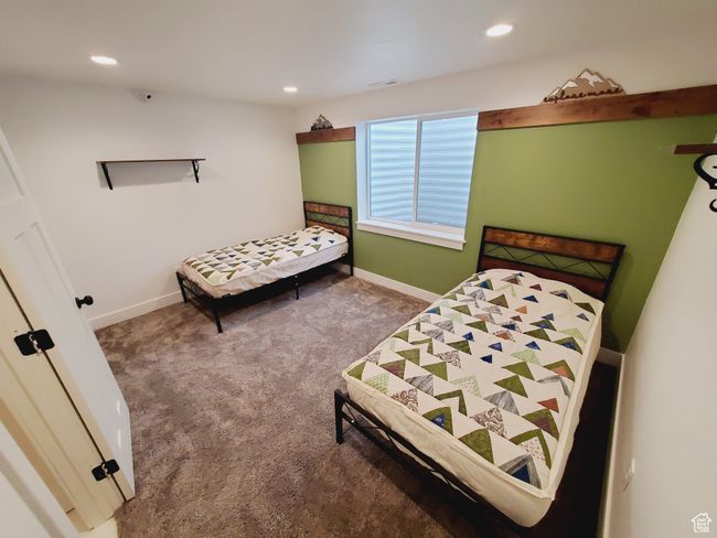 Bedroom with carpet floors, visible vents, baseboards, and recessed lighting | Image 25