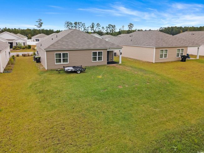 Rear view of house with a yard | Image 32