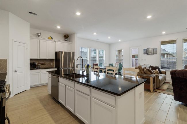 The farmhouse sink is a great feature in this large kitchen. | Image 16