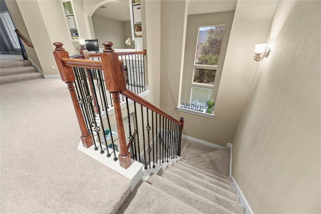 Second stair case leads to upstairs office/study and offers a view of the backyard. | Image 27